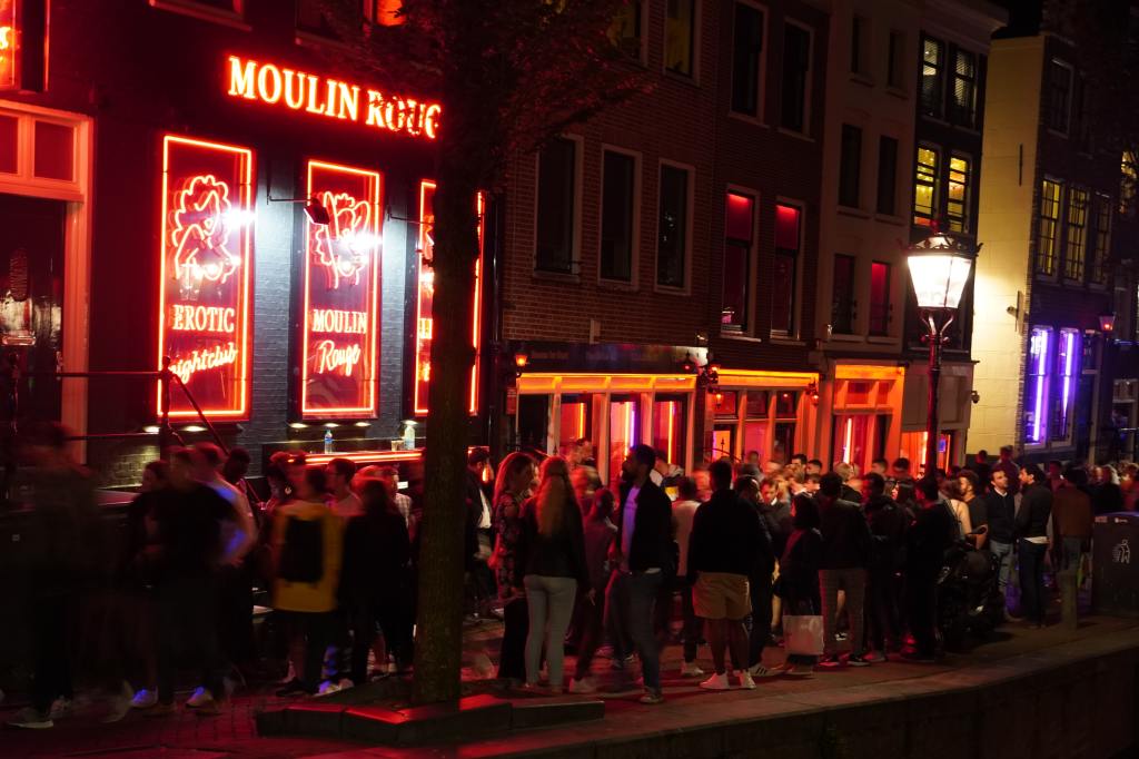 Crowds filling the streets of Amsterdam's Red Light District.